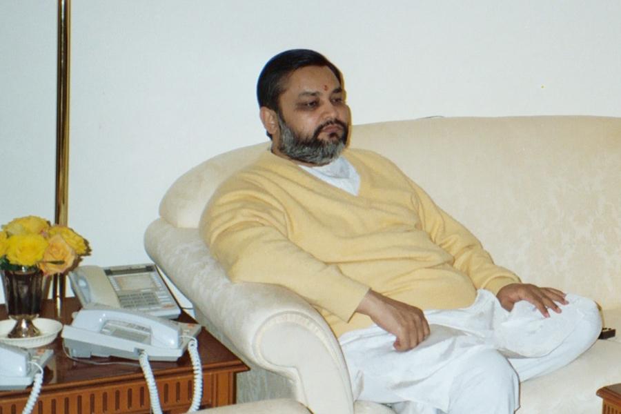 Brahmachari Girish Ji enjoying a conference call with Maharishi Ji in his home at MERU Campus, Holland. Dec. 2002