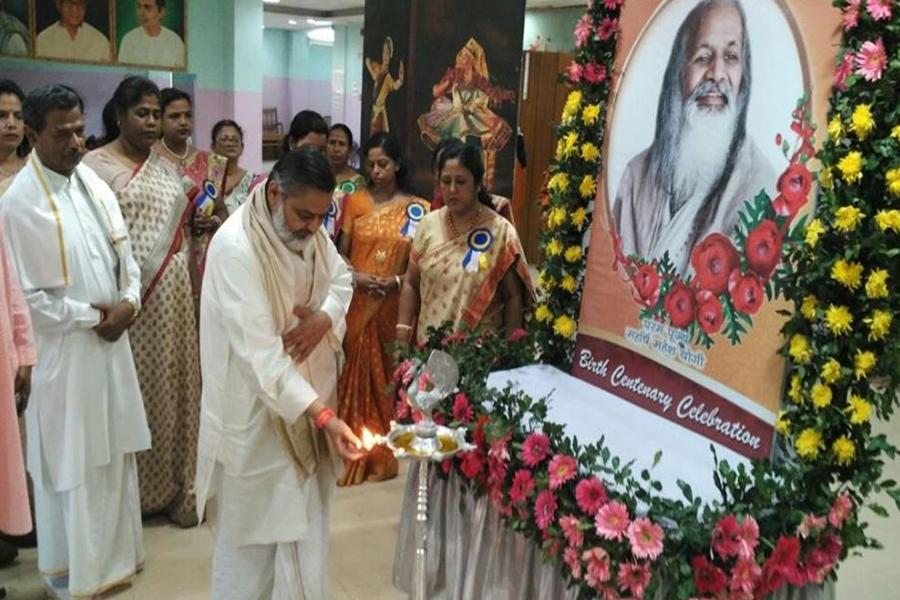 Brahmachari Girish Ji lighting the lamp at Silchar Conference.