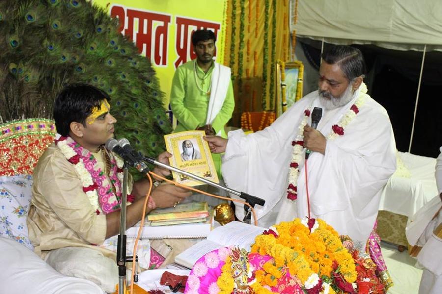 Brahmachari Girish Ji is presenting Maharishi Ji's calendar and Book to Acharya Updesh Krishna Shastri Ji on Ram Navami Day
