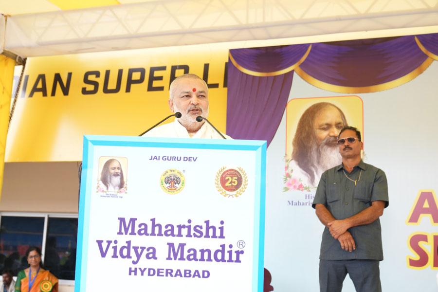 Hon'ble Chief Guest Brahmachari Girish Ji, chairman of Maharishi of Institutions addressing the audience at the Silver Jubilee celebration of MVM Hyderabad at at GMC Balayogi Athletic Stadium, Gachibowli, Hyderabad on 7th December 2024. More than 3000 students from Class Nursery to XIl participate in various cultural and sports events. The function was well attended by over 8000 parents and guests.